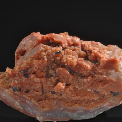 Groutite on petrified wood