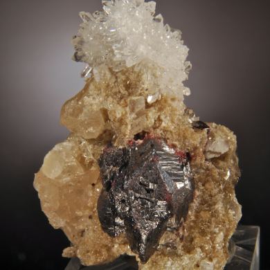 Cinnabar (twinned crystals on Quartz and Calcite)