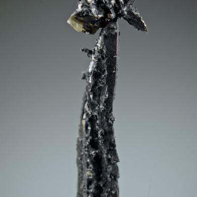 Silver, elongated spinel-twin, floater