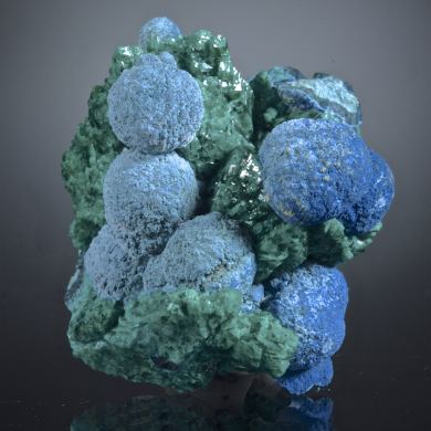 Shattuckite balls on Dioptase