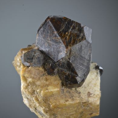 Spessartine on Orthoclase 